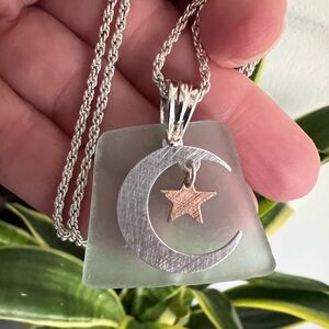 Hand Crafted Aqua Tinted Sea Glass with a Star & moon Charm